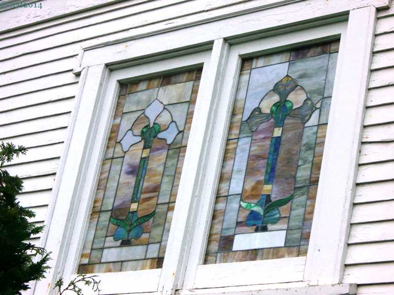 A close up view of two stained glass windows in the United Methodist church, Amity, Oregon.